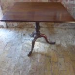 A Georgian and later tilt top tripod table with a one piece rectangular top 69 cm tall 69 x 79