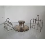 Two small silver toast racks, one with a broken joint, approx 2.9 troy oz and a silver capstan