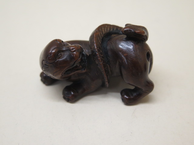 Two carved wooden Netsukes of a lion and serpent, 4.5cm tall and a seated figure 3.5cm tall, both - Image 2 of 8