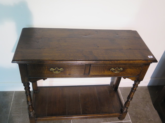 A 19th century oak side table with two drawers and an undertier, 84cm tall x 97cm x 41cm, with - Image 2 of 4