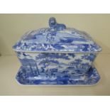 A 19th century blue and white chinoiserie transfer decorated lidded tureen on stand, 23cm tall x33cm