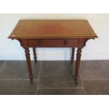 A Victorian mahogany side table with a single drawer and leather inset on top on turned legs, 73cm