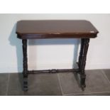 A Victorian mahogany stretcher table, 71cm tall x78cm x 38cm