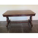A 19th century rosewood and burr walnut stretcher table on lyre end supports united by a barley