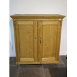 A 19th century pine continental two door cupboard, 130cm tall x 120cm x 59cm ideal kitchen cupboard