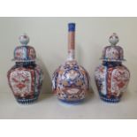 An Imari bottle vase, 41cm tall x 19cm wide, repair to top otherwise generally good and a pair of