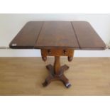 A burr walnut dropleaf side table with a frieze drawer on an octagonal column and platform base,