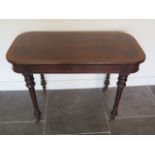 A walnut centre table on turned legs, stamped Willis & Cheal Buchers St Glasgow no 11512, 73cm