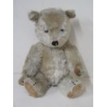 A vintage Mohair teddy bear, 35cm tall, some playwear but reasonably good