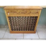 A new pine 70 bottle wine rack with three wine box fronted drawers made by a local craftsman to a