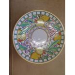 A Charlotte Rhead Bursley Ware fruit and flower decorated charger, no T238, 31cm diameter, in good