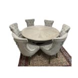A good designer circular pedestal dining table with a washed grey segmented top and 6 grey button ba