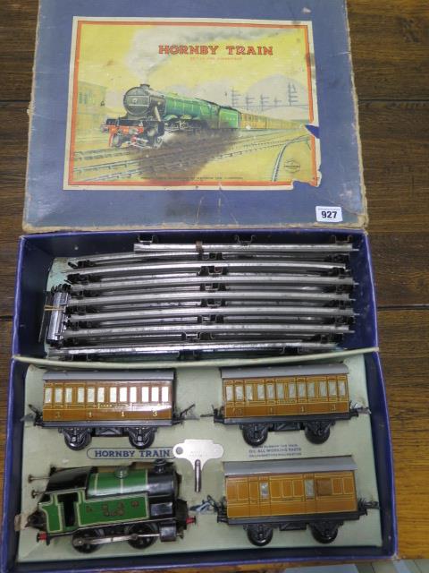 A boxed Hornby 0 gauge number 101 tank passenger clockwork train set, some wear but running with key