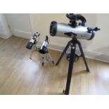 A Celestron Starsense Explorer Lt telescope with two lenses, a Lanneret telescope and a similar