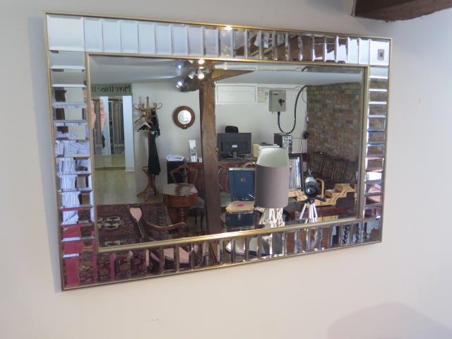 A modern cushion mirror, 61cm x 92cm