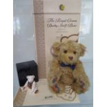 A Steiff Royal Crown Derby bear, mohair, 24cm tall, Limited Edition number 656 of 2000, boxed with