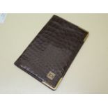A good quality Mappin and Webb crocodile wallet with hallmarked 9ct yellow gold front corners,