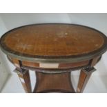 A French style parquetry top oval side table with two drawers and oval mounts, some veneer losses