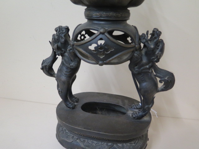 An Oriental bronze lamp with two temple dogs supporting a ball and lotus with an entwined dragon, - Image 2 of 8