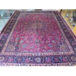 A good vintage Persian Mashad hand woven richly coloured woollen rug with unique shah saffi