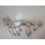 Six assorted silver back dressing table mirrors and brushes, a part silver manicure set, three