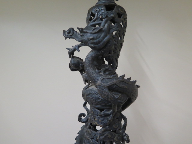 An Oriental bronze lamp with two temple dogs supporting a ball and lotus with an entwined dragon, - Image 3 of 8