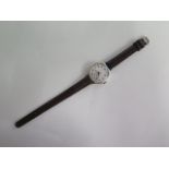 A silver case 1930s ladies wristwatch, has a CYMA 15 jewel lever movement with an enamelled dial,