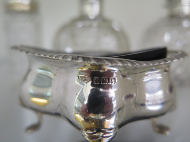 Four silver top bottles, a silver plated powder bottle, two silver rim glass salts, a silver - Image 3 of 5