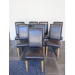 A set of eight modern brown faux leather effect high back dining chairs, 107cm tall
