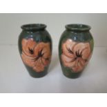 A pair of Moorcroft green ground vases, 10cm tall, in good condition