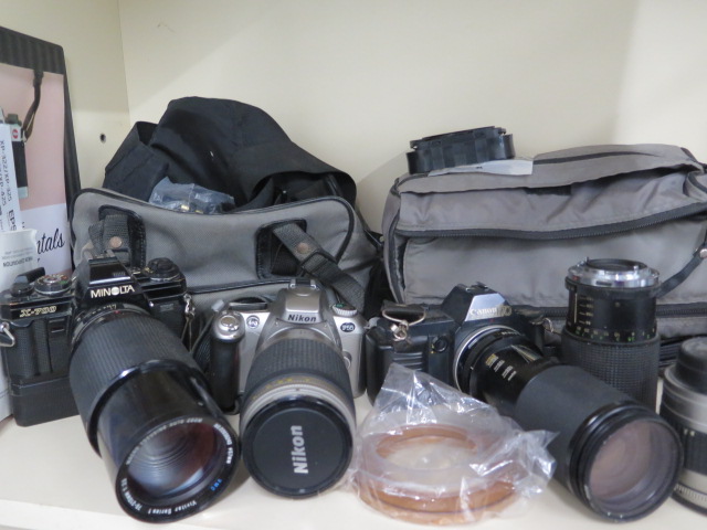 A collection of four SLR cameras with assorted lenses: Minolta X-700, Nikon F55, Canon T70, - Image 4 of 4