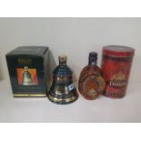 A 15 year old Dimple bottle of Deluxe Scotch whisky 70cl, and a Bells 1995 70cl Bell of Extra