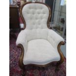 A Victorian mahogany button back upholstered armchair, recently re-upholstered and in good
