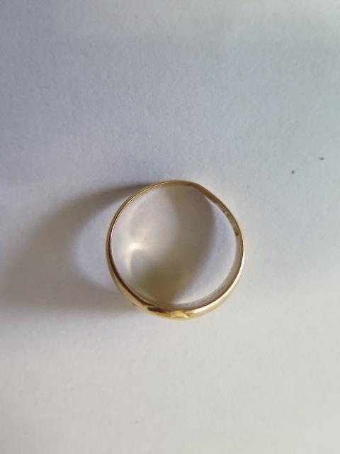 A hallmarked 18ct yellow gold signet ring, size P, approx 5.6 grams, some bending and wear but no - Image 2 of 2