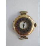 A 9ct gold Trench type watch, manual wind, 2.5cm wide, no strap or glass but running and hands