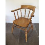 An ash and elm smokers bow armchair on turned legs and supports, 80cm tall x 64cm wide x seat height
