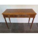 A new walnut three drawer hall table on turned reeded legs made by a local craftsman to a high