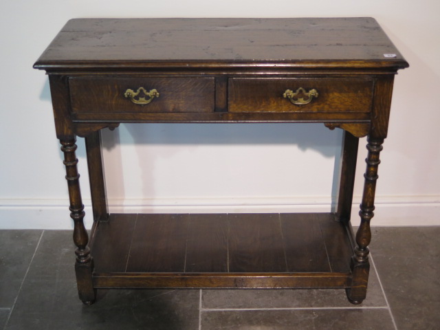 A 19th century oak side table with two drawers and an undertier, 84cm tall x 97cm x 41cm, with