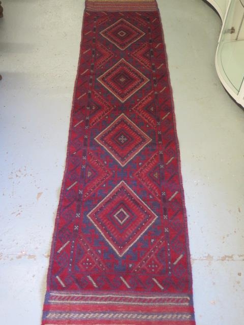 A hand knotted woollen Meshwani runner, 246cm x 60cm