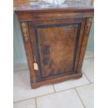 A 19th century walnut inlaid pier cabinet with a single door and ormulu mounts, 112cm tall x 83cm
