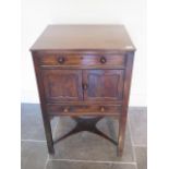 A Georgian and later mahogany wash stand with two drawers and two cupboard doors, 79cm tall x 52cm x