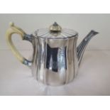 An Edwardian silver fluted teapot, London 1907/08 Sebastian Garrard, 22cm long, approx 25.9 troy oz,