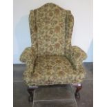 A good reupholstered wing back armchair on ball and claw feet in good condition, 124cm tall x 94cm
