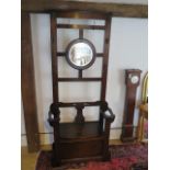 An oak mirror back hallstand bench with lift up seat and a CC Richards of Wivelscombe label, 199cm