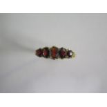 A hallmarked 9ct yellow gold five stone garnet ring, size R, approx 2.9 grams, generally good
