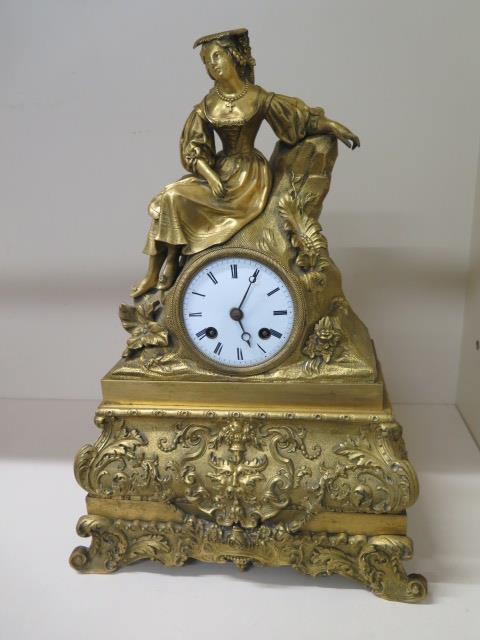 A French bronze ormulu figural striking mantle clock, 40cm tall x 27cm wide x 12cm deep, with silk