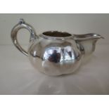 A Russian 84 silver cream jug, Petersburg mark C.A.J, approx 5.4 troy oz, 14cm long, two small dents