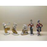 A pair of Sitzendorf white and gilt exotic dancers, 22cm tall, and another Sitzendorf group, all
