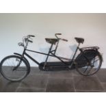 A Vintage Dutch STRAALJAGER tandem bicycle with drum front and rear brakes, magneto lights in