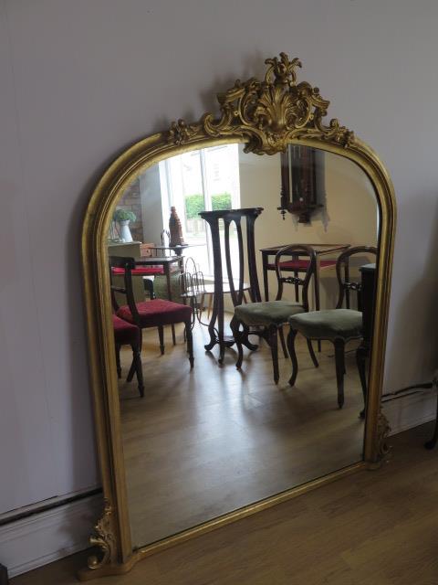An ornate gilt Victorian style over mantle mirror, 154cm tall x 136cm wide, in good condition